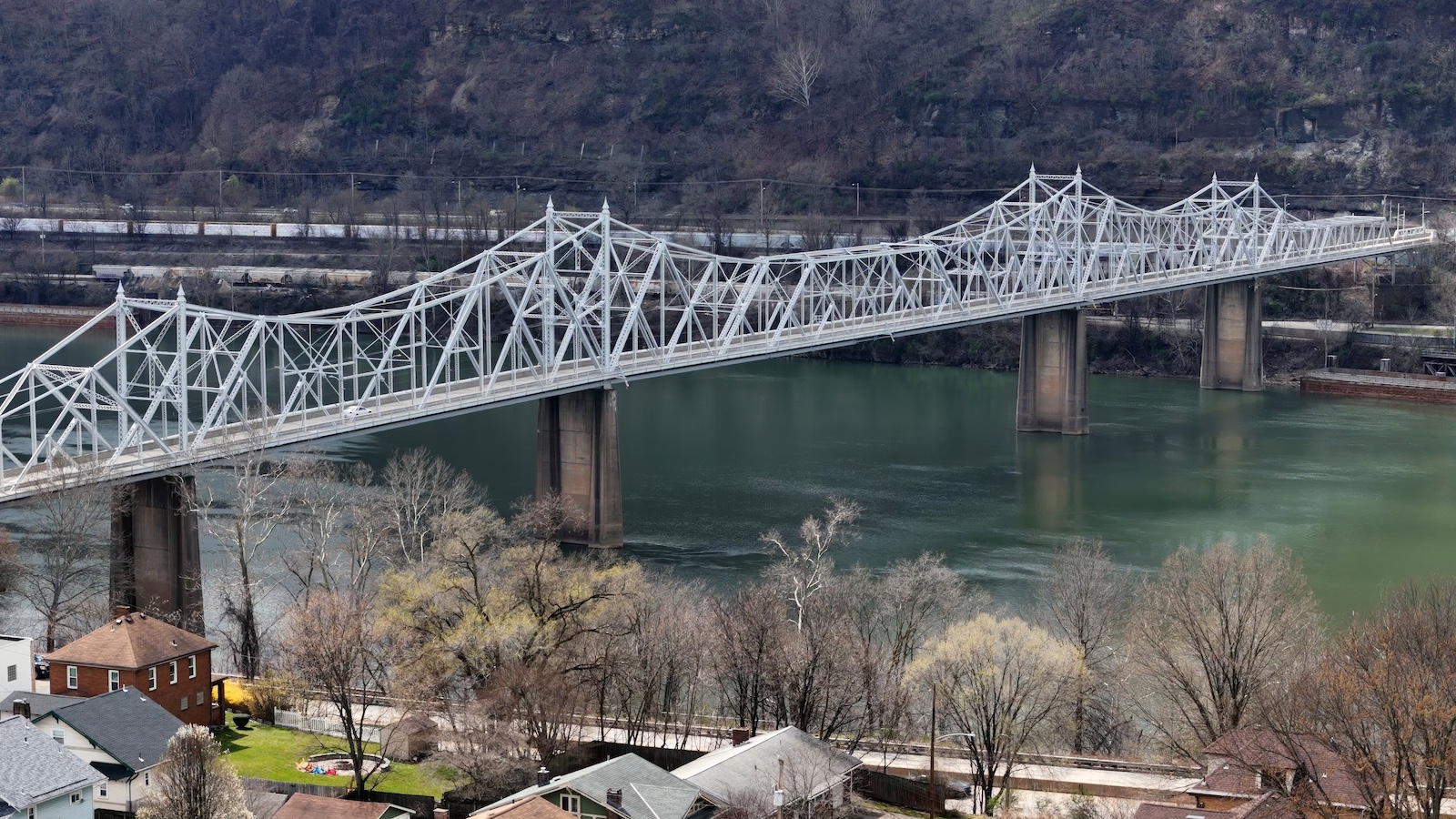 An,Aerial,Establishing,Shot,Of,The,Ambridge,Bridge,Over,The An aerial establishing shot of the Ambridge Bridge over the Ohio River in late winter. Pittsburgh suburbs.